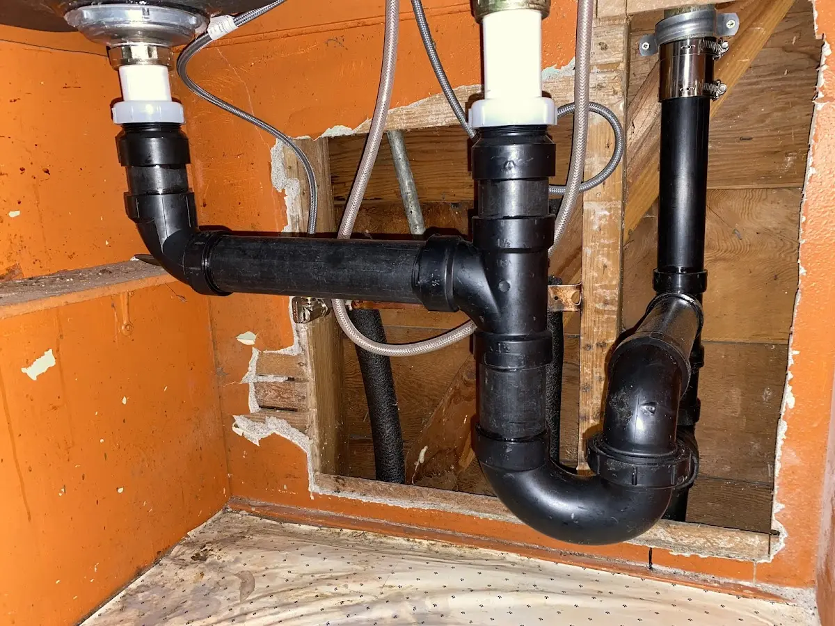 Professional Garbage Disposal Repair equipment and tools on the job in Hanamaulu
